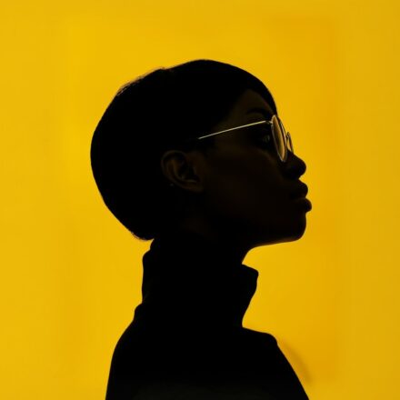 Contemplative Silhouette in Yellow
